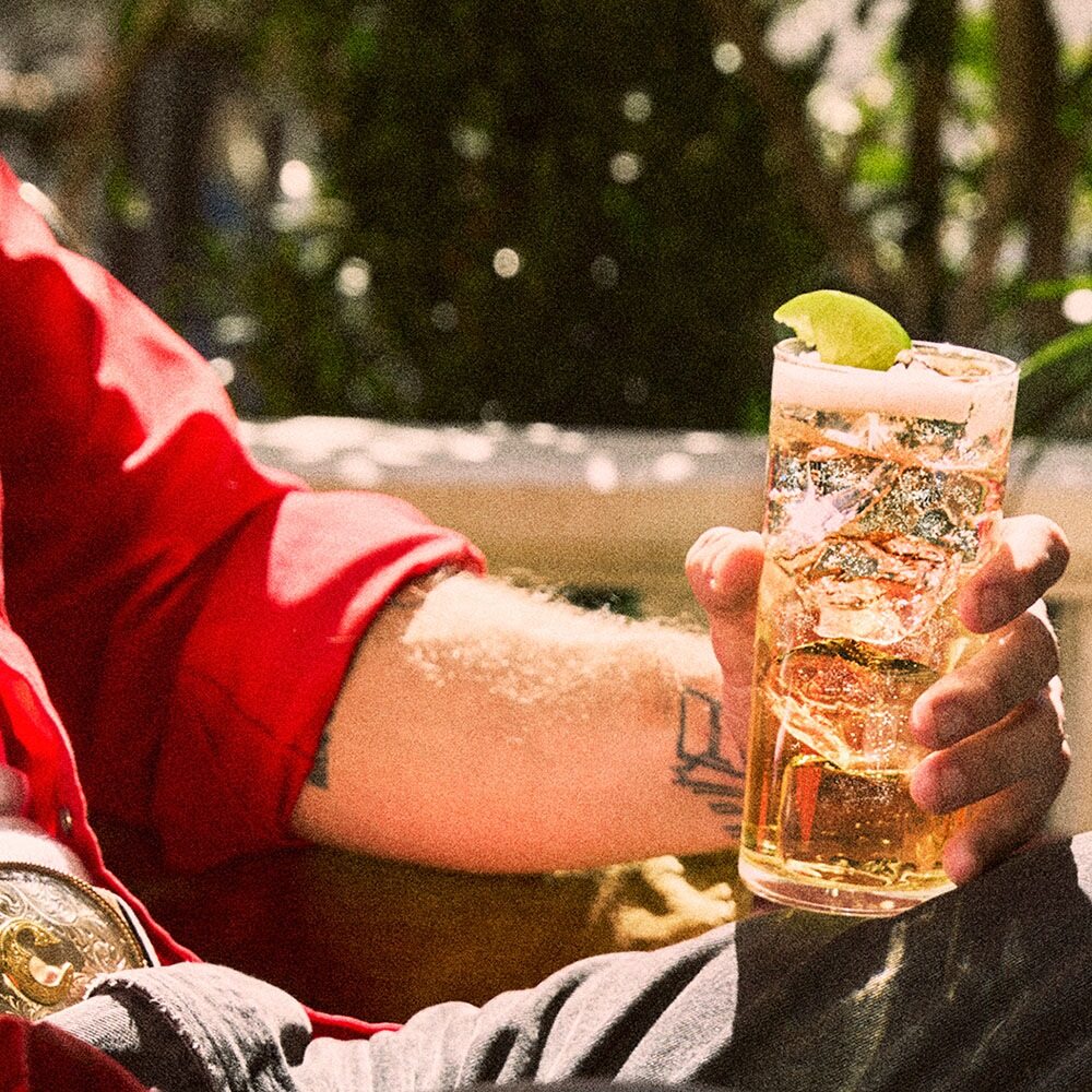 Outdoor Bourbon Cocktail Tall Glass Ice Lime Garnish Jim Beam