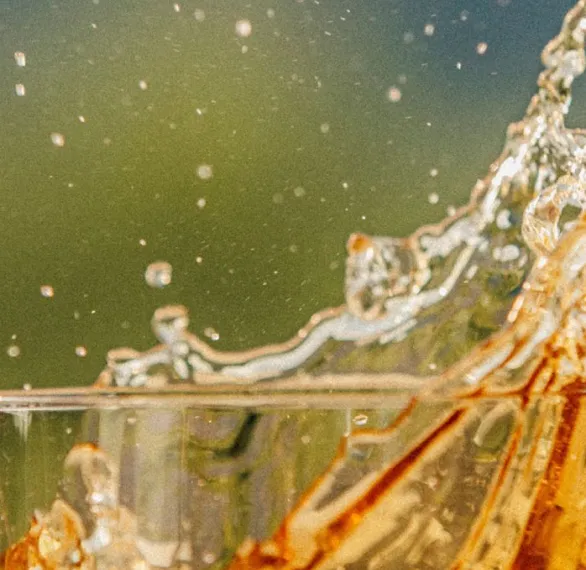 drink splashed from jim beam bourbon glass