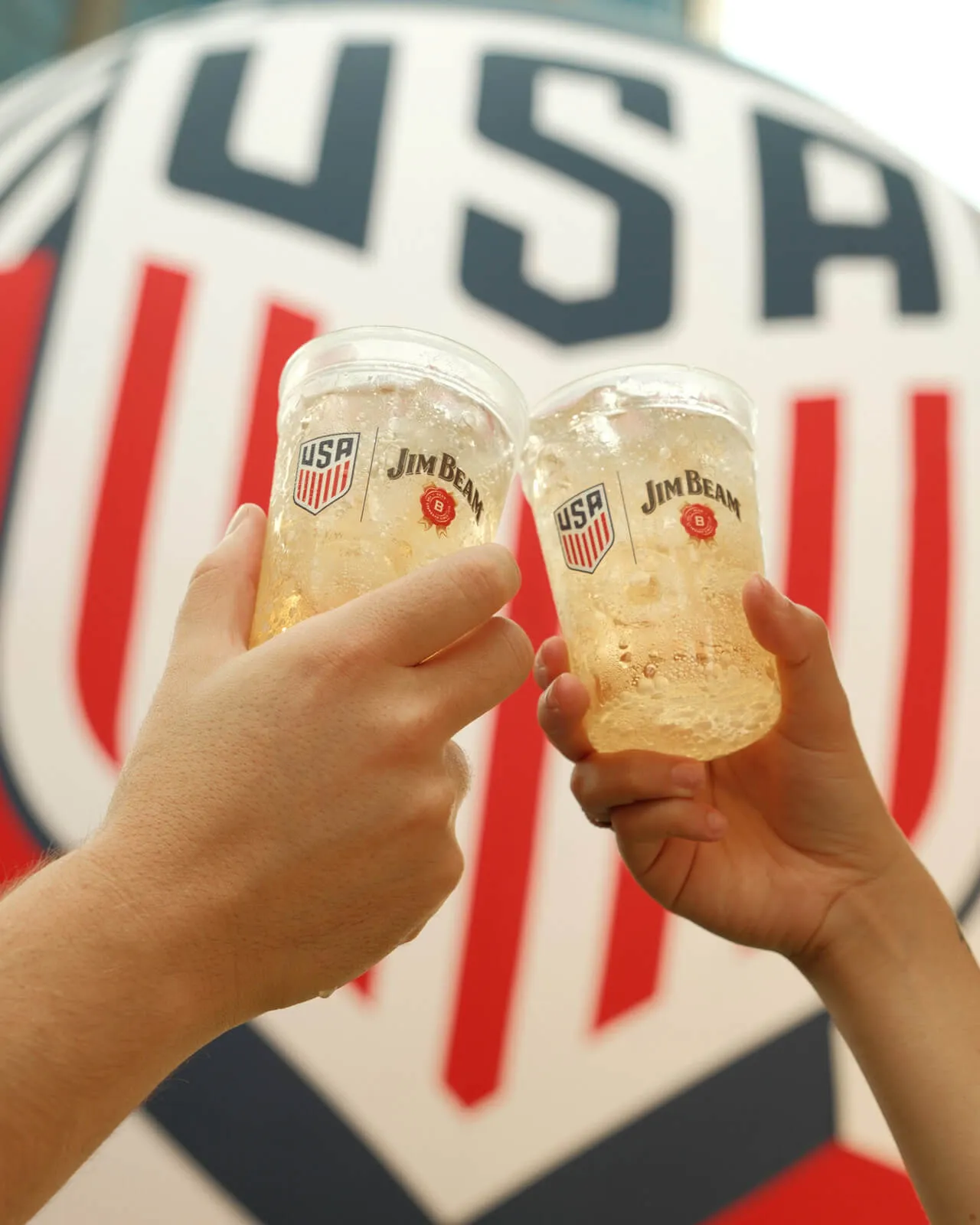 Jim Beam Block Party toast and a big logo background
