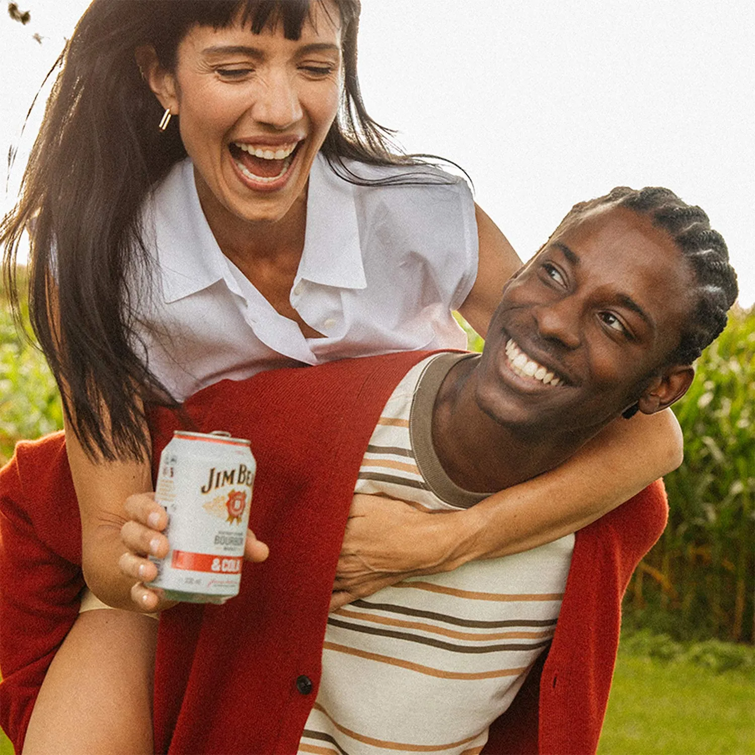 People with Jim Beam Ready to Drink Cola Can