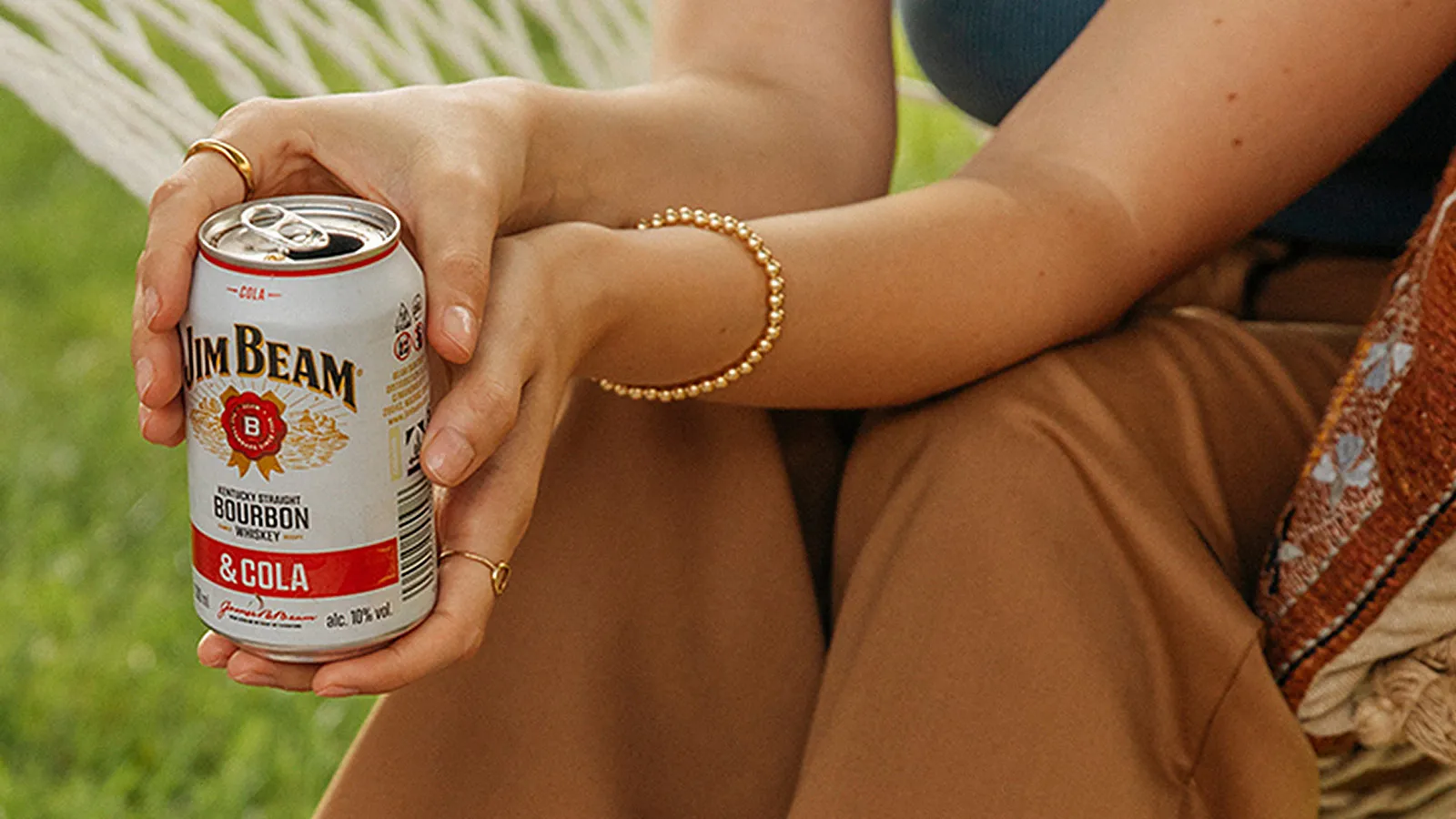 Woman with Jim Beam Ready to Drink Cola Can