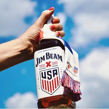Hand Holding Limited Edition USA Bottle Jim Beam