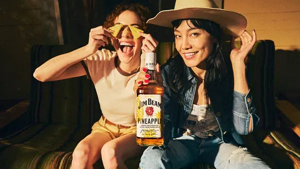 Image of two people enjoying JimBeam Pineapple