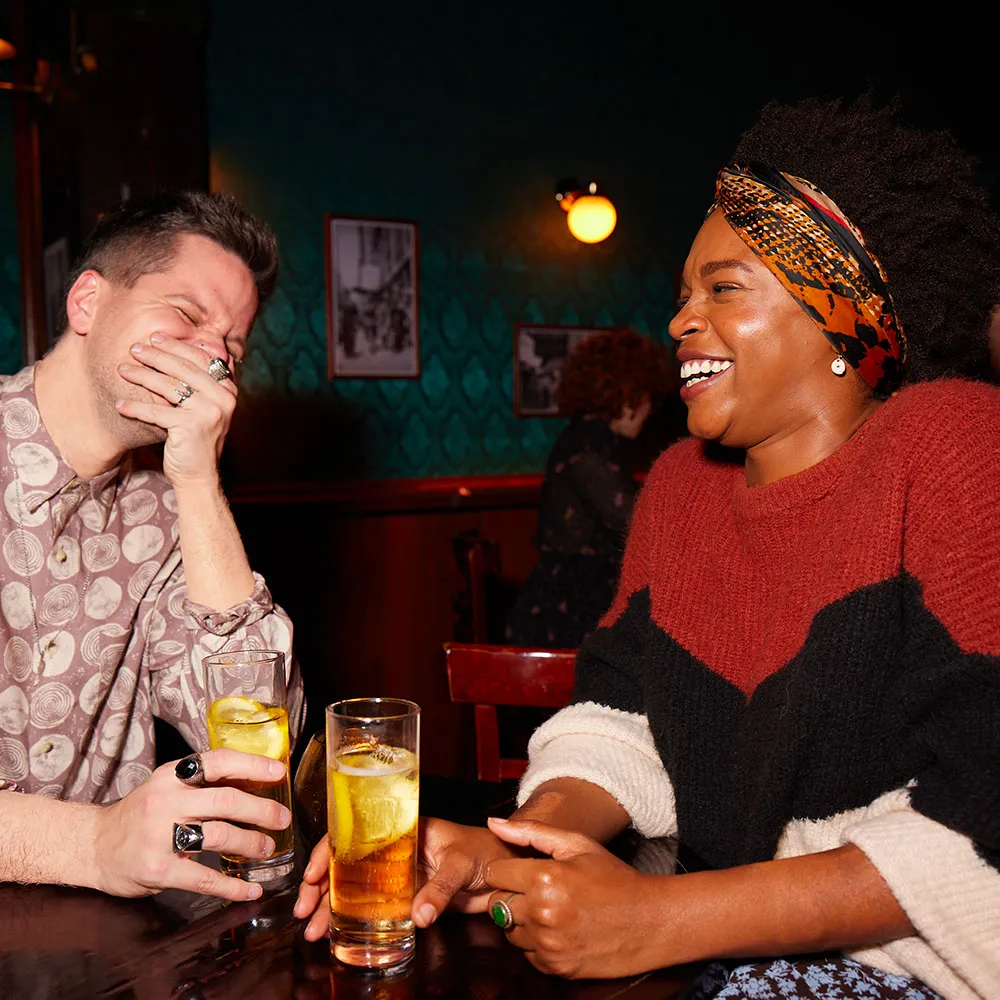 friends laughing while drinking jim beam