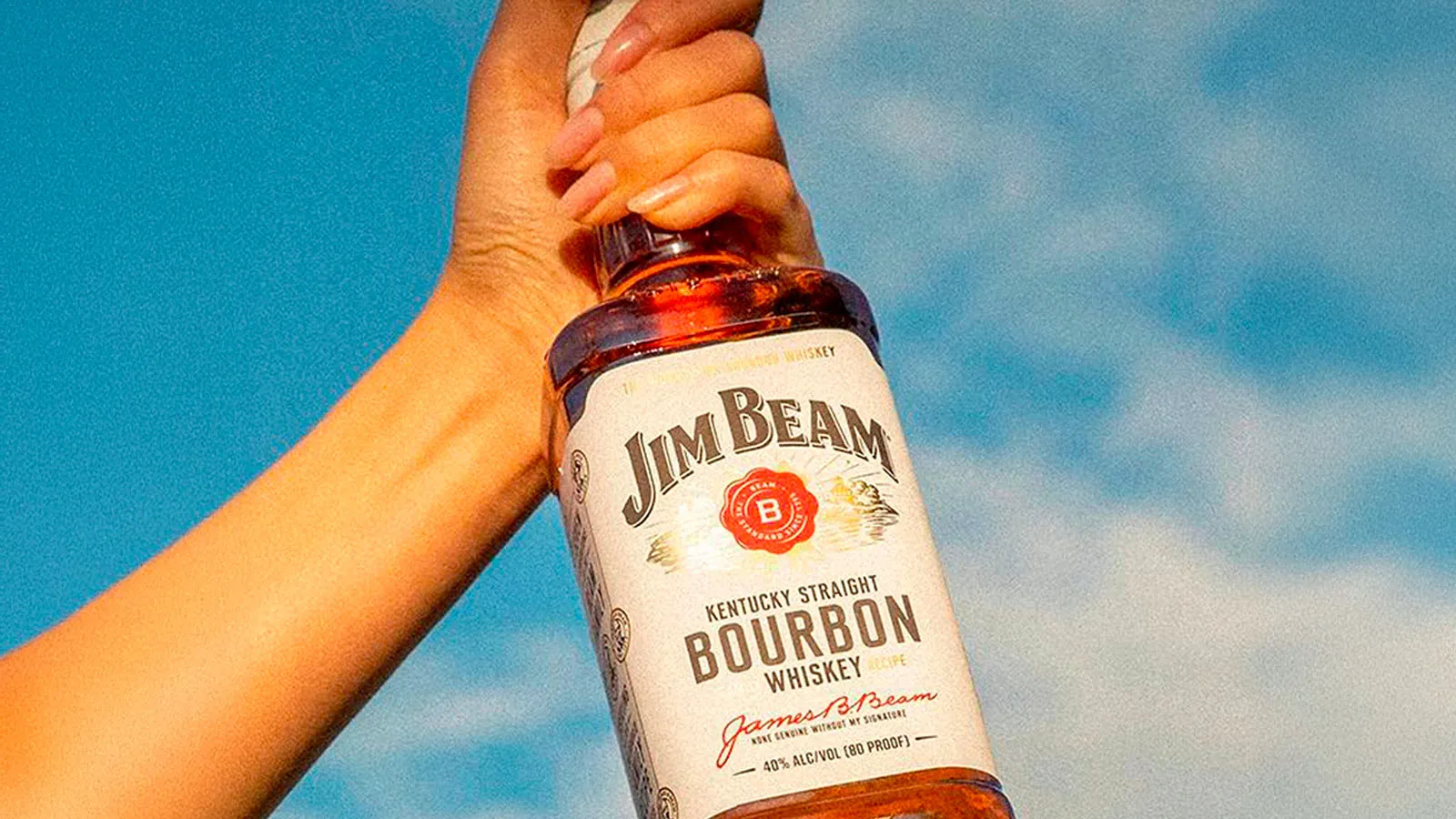 jim beam white bottle in hand
