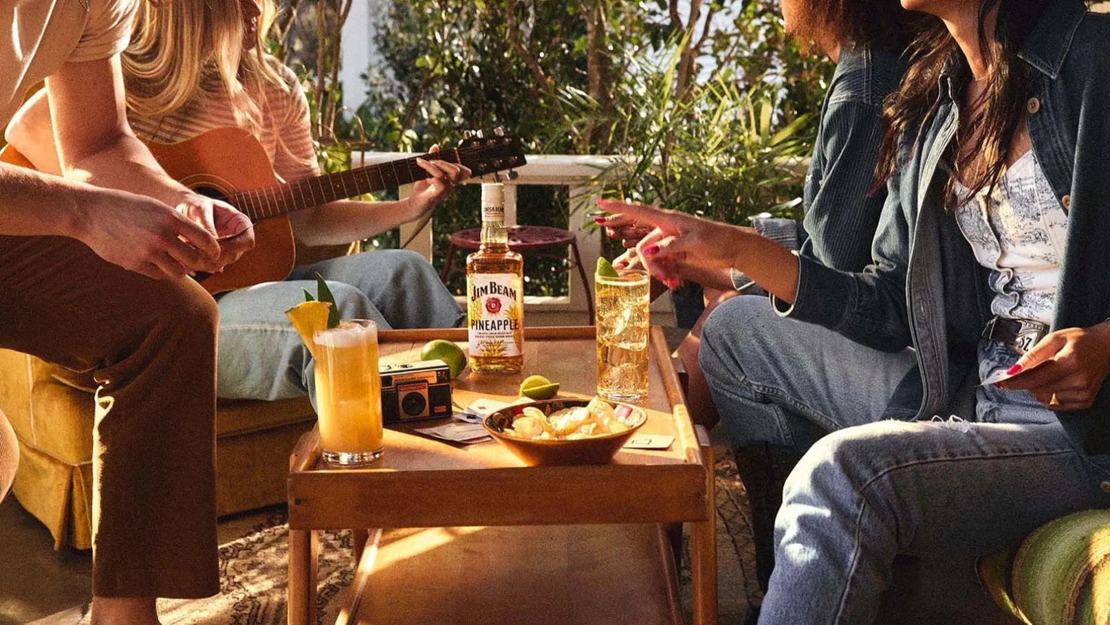 Outdoor Gathering Friends Guitar Cocktail Glass Pineapple Bourbon Bottle Table Jim Beam