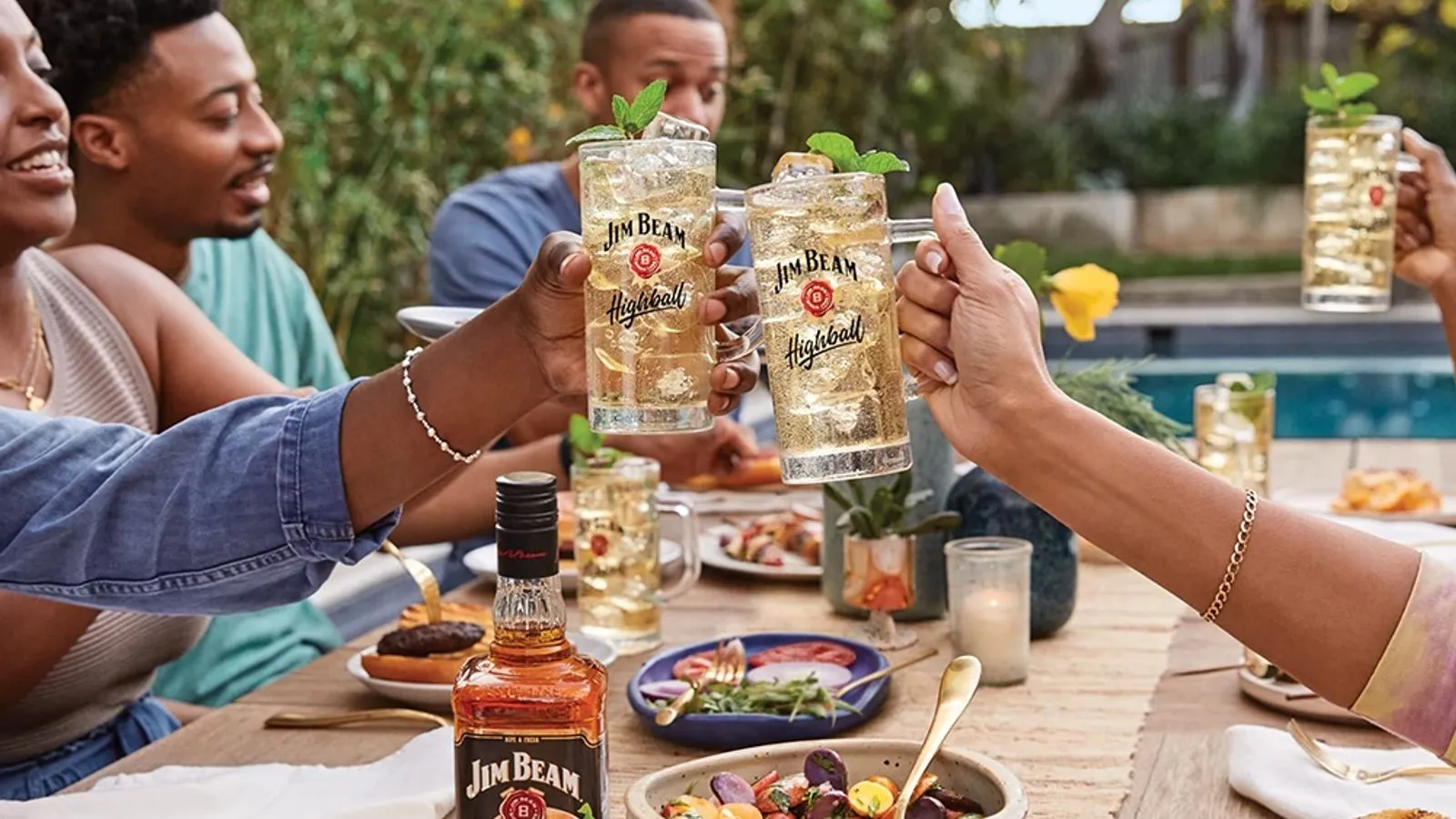 People cheering with glasses of wine