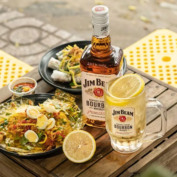 Jimbeam Bottle Along With Snacks And Glass Image